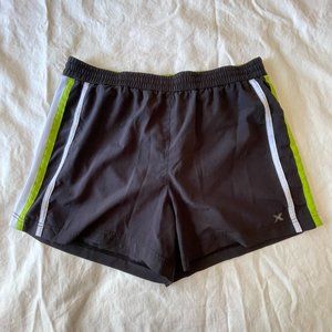 Black Athletic Shorts with White Mesh Side Panels and Lime Green Details